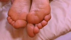 Flexible pale brunette with foot fetish does hot footjob