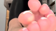 Tattooed busty brunette with foot fetish does hot footjob